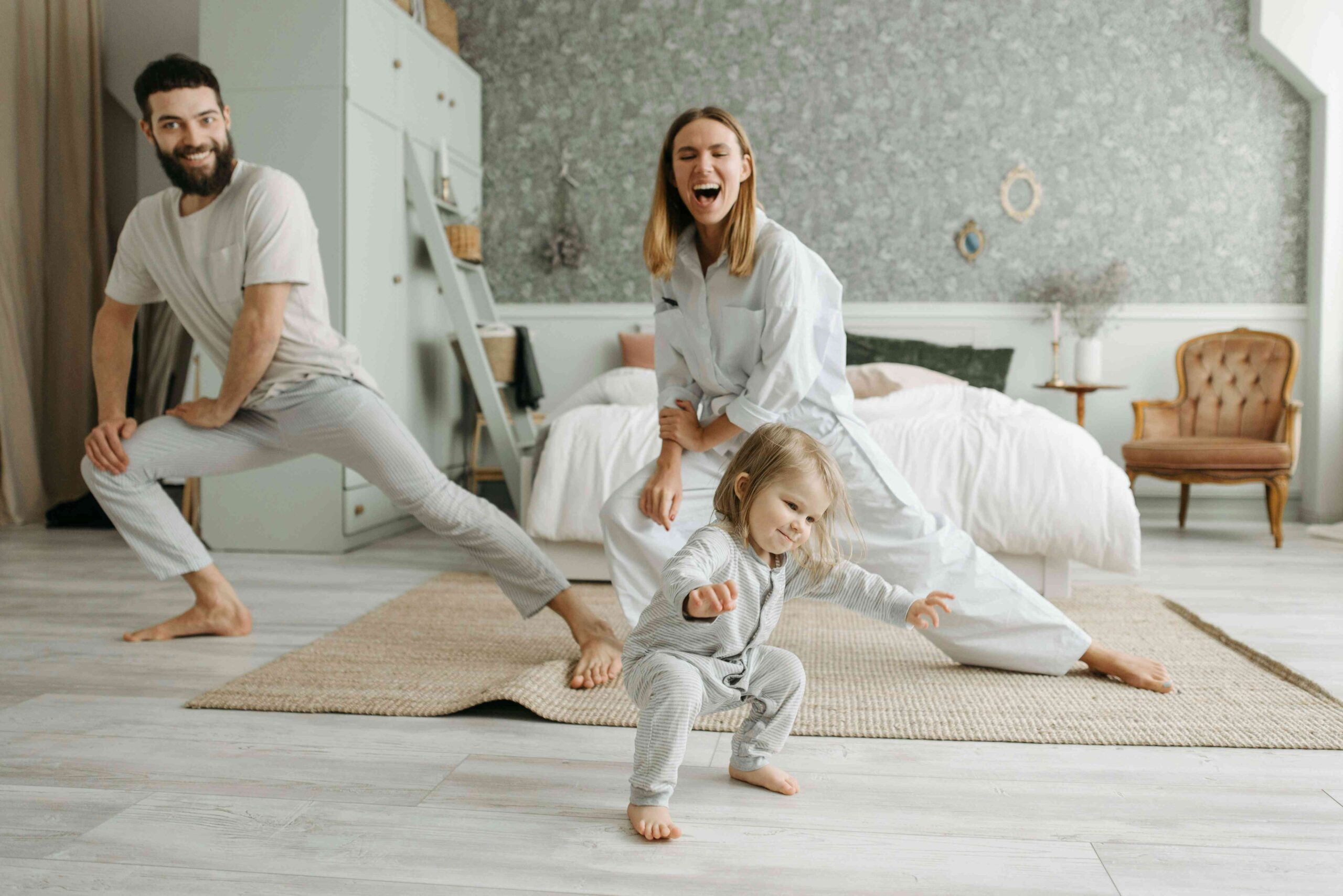 Happy family enjoying calmer nights after gentle holistic baby sleep support no cry it out